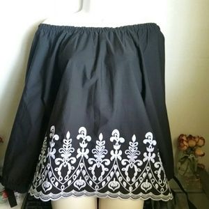 Black, white embroidered, long-sleeve.